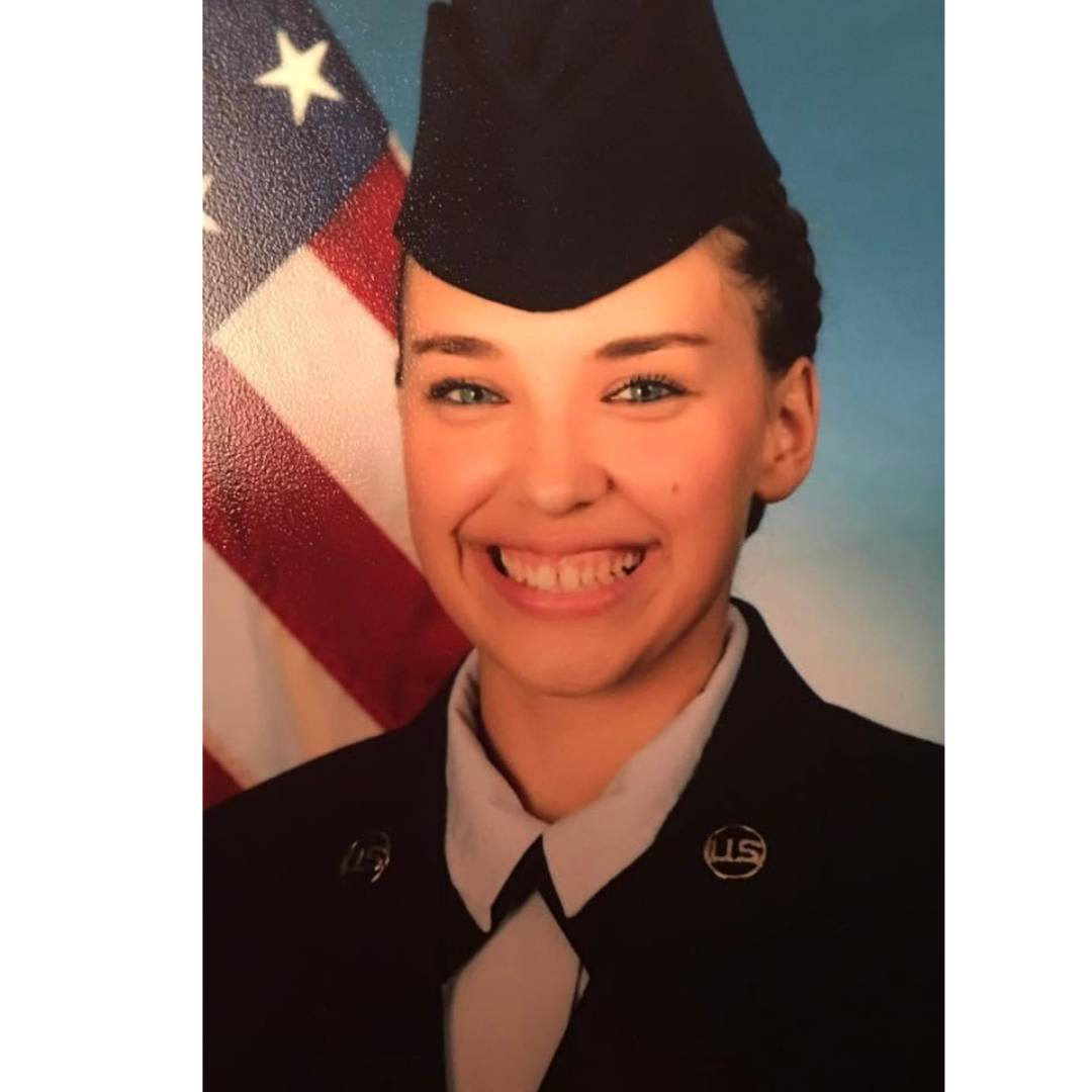 Shelby Huerta wears a uniform and a hat in her headshot